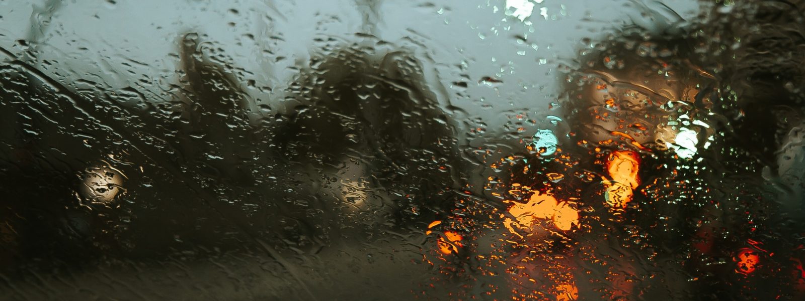 street scene through rainy window