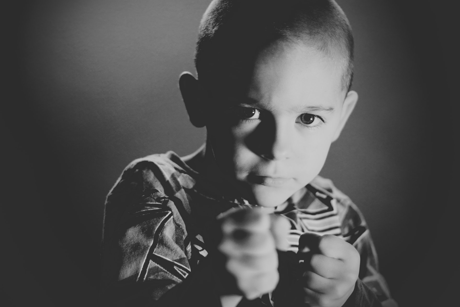 child with fists in defensive posture